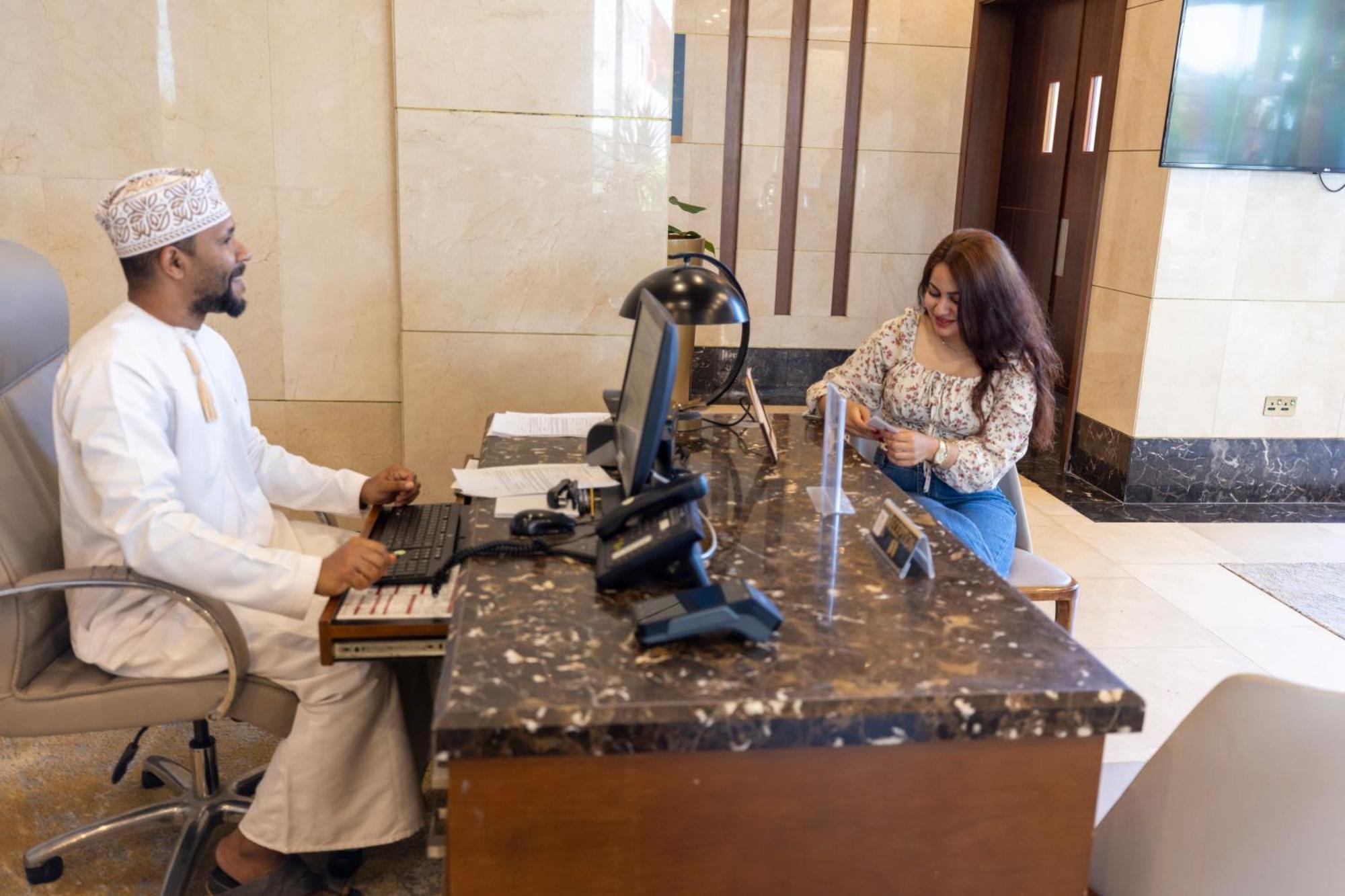 Millennium Resort Салала Экстерьер фото A hotel receptionist in Oman