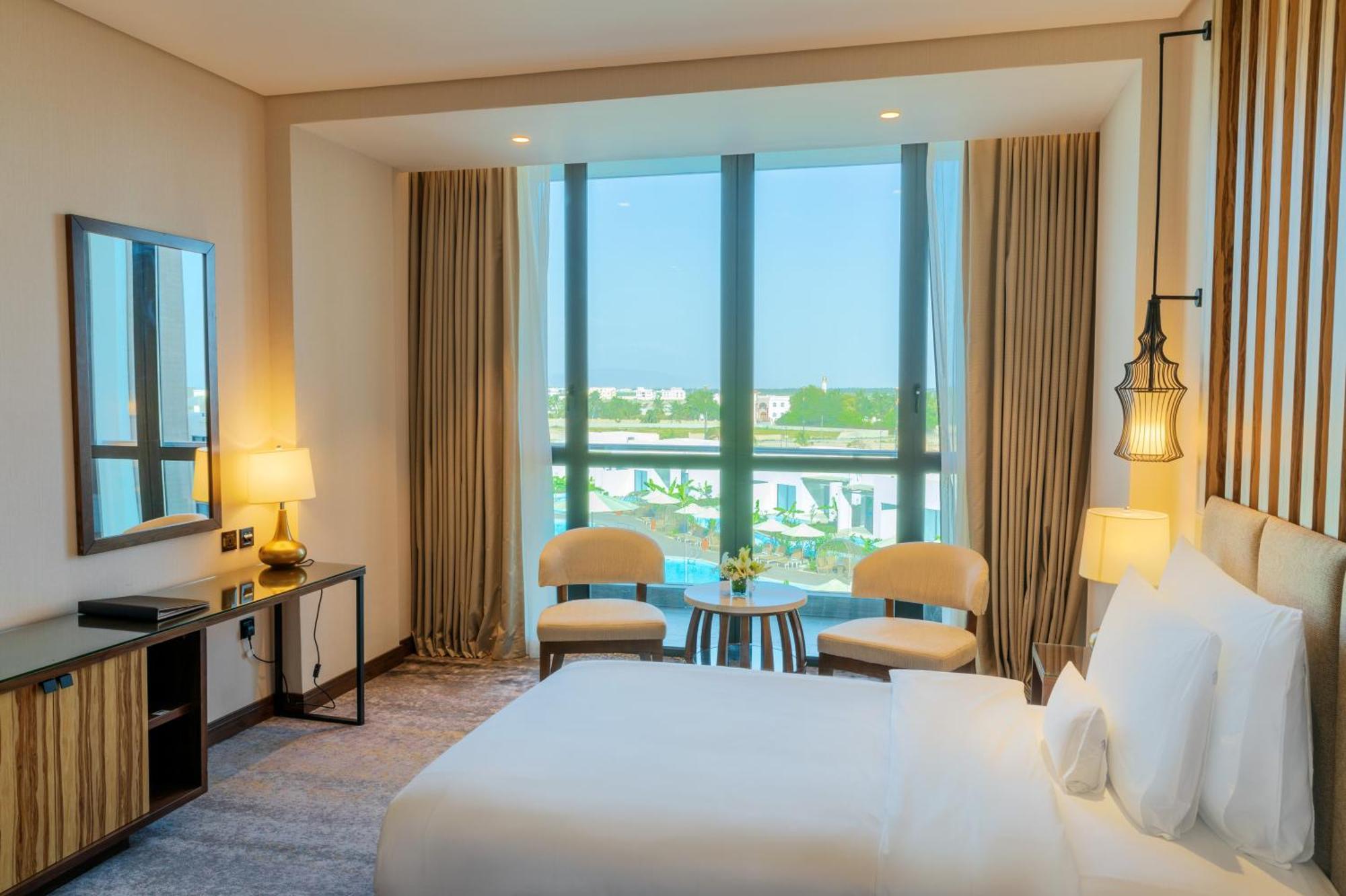 Millennium Resort Салала Экстерьер фото Deluxe room